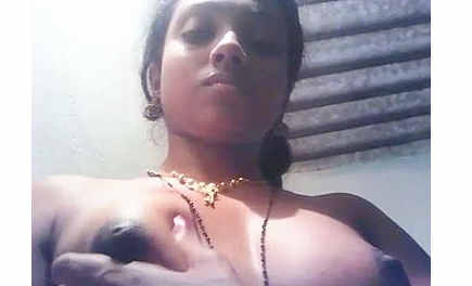 Horny Tamil girl self pressing tight boobs & nipples